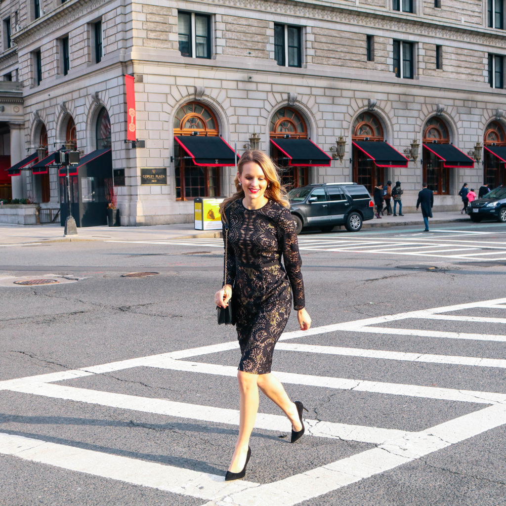 Life + style blogger Leigha Gardner of The Lilac Press wearing a sleeved black dress in Copley Square, Boston.