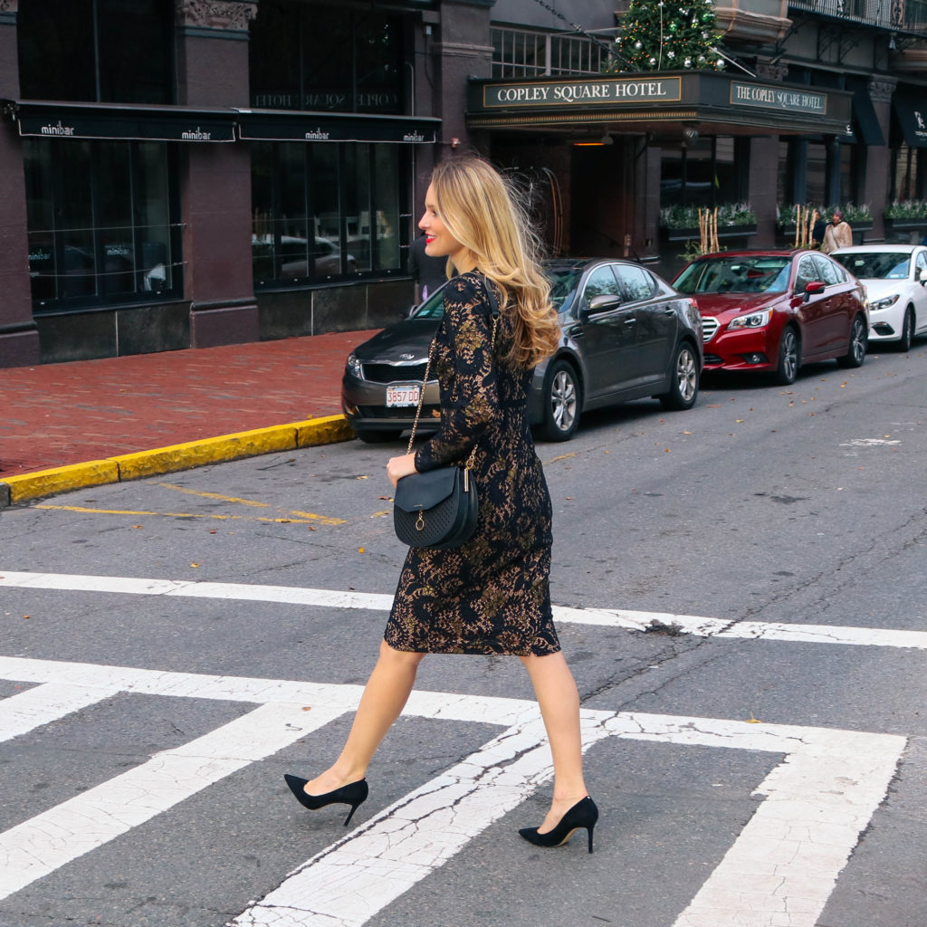 Life + style blogger Leigha Gardner of The Lilac Press wearing a sleeved black dress in Copley Square, Boston.