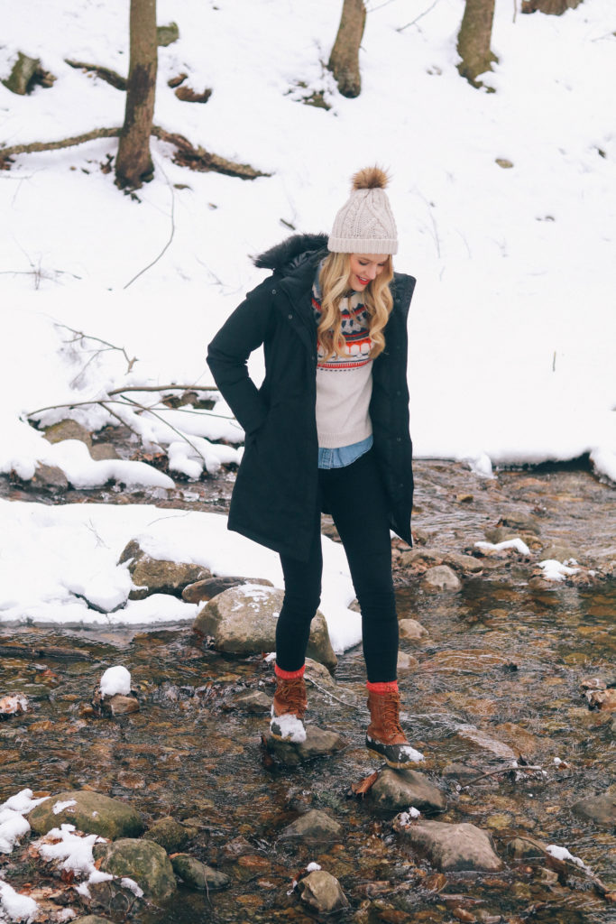 Lifestyle blogger Leigha Gardner of The Lilac Press frolicking in the snow after a storm in the Berkshires
