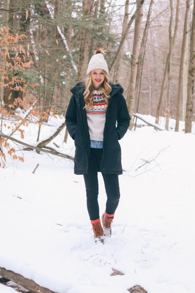 Lifestyle blogger Leigha Gardner of The Lilac Press frolicking in the snow after a storm in the Berkshires