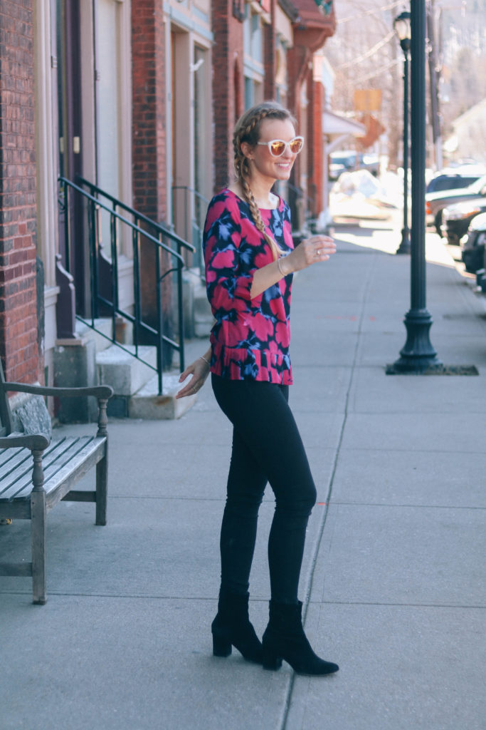 Fashion blogger, Leigha Gardner, of The Lilac Press wearing a floral pleated blouse while hanging out downtown.