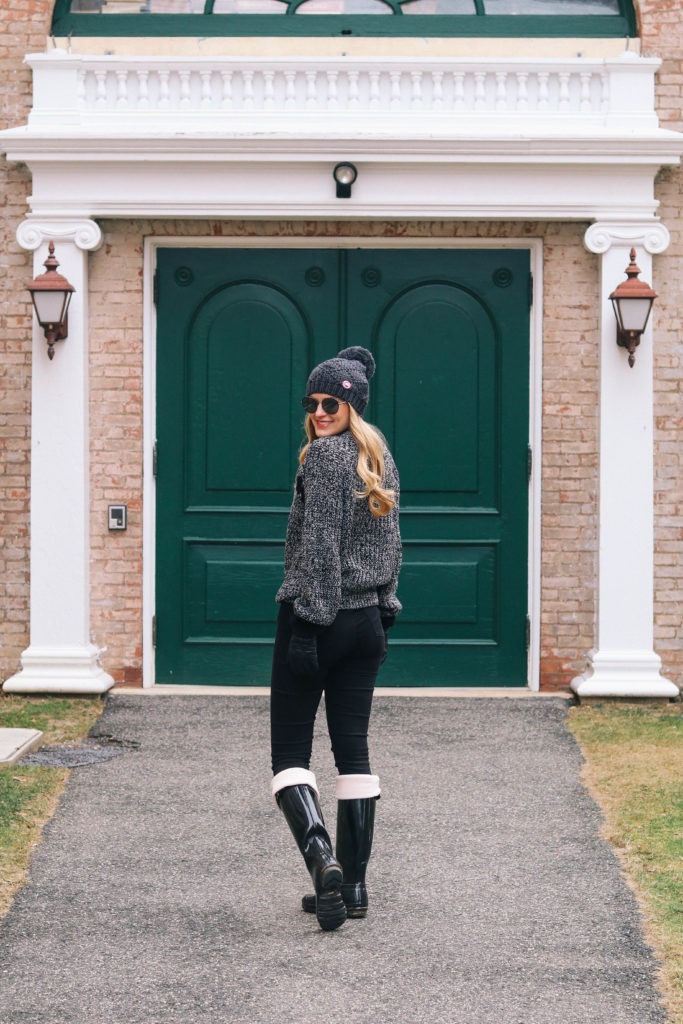 Lifestyle blogger Leigha Gardner of The Lilac Press wearing a marled gray and black lace-up sweater by J.O.A.