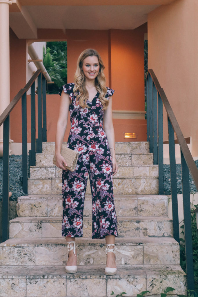 Style blogger Leigha Gardner of The Lilac Press wearing a floral Club Monaco jumpsuit while heading to dinner on Saint Thomas, USVI