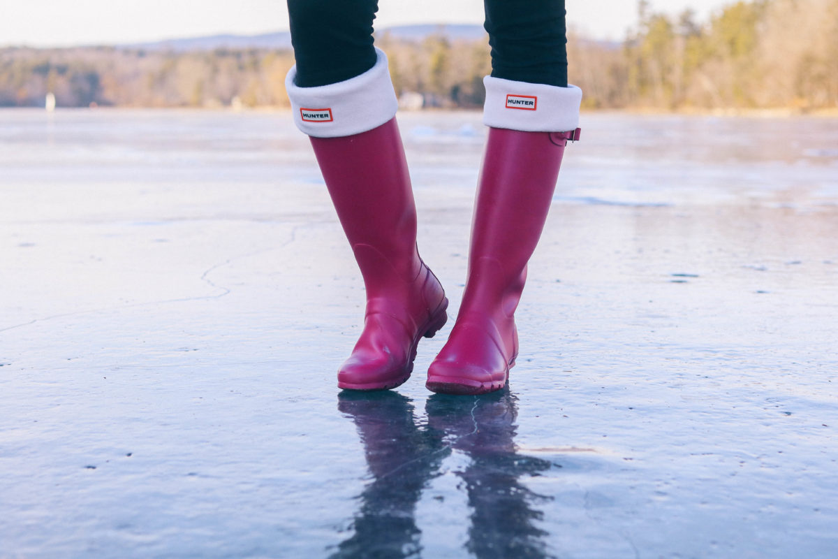 Lifestyle blogger Leigha Gardner of The Lilac Press exploring frozen Laurel Lake in the Berkshires for some "ice skating" (with Hunter boots).