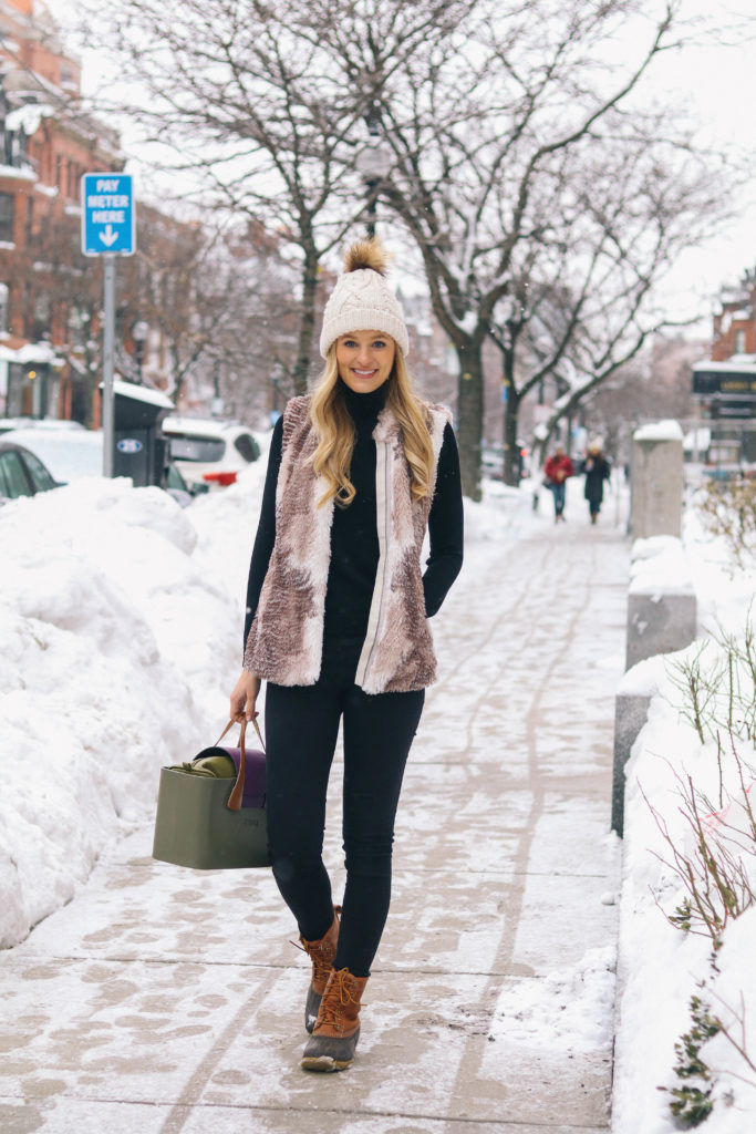 Lifestyle and fashion blogger Leigha Gardner on Newbury Street sharing what she loves about O Bag Boston in the wintertime, a customizable practical handbag line.