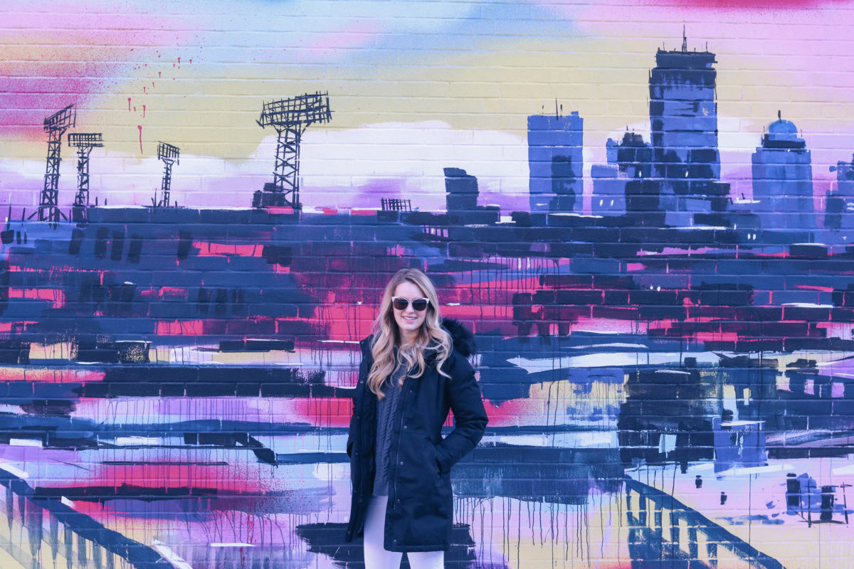 Lifestyle blogger Leigha Gardner of The Lilac Press exploring unexpected color pops in Boston (wall crawl).
