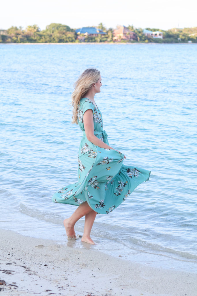 Fashion blogger, Leigha Gardner, of The Lilac Press wearing a Free People floral maxi dress at the beach in St. Thomas.