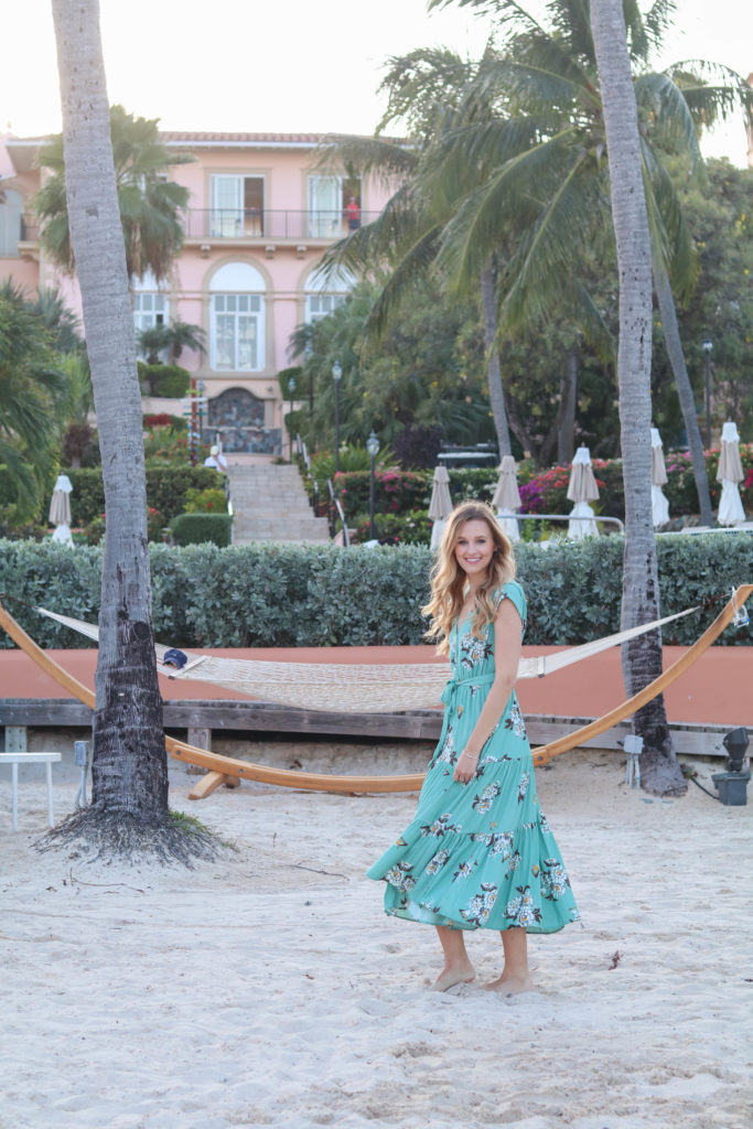 Fashion blogger, Leigha Gardner, of The Lilac Press wearing a Free People floral maxi dress at the beach in St. Thomas.