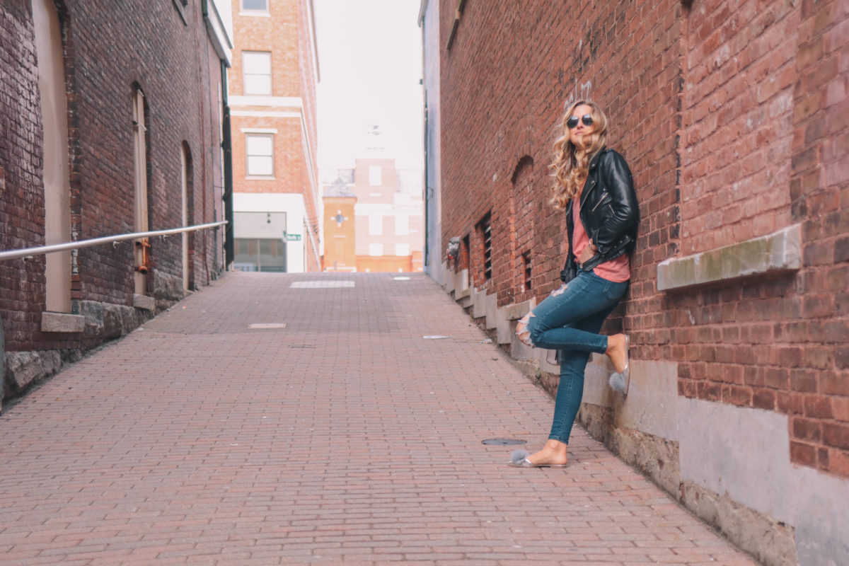 Lifestyle blogger, Leigha Gardner, of The Lilac Press wearing a leather jacket and sharing tips for pulling off an edgier look.