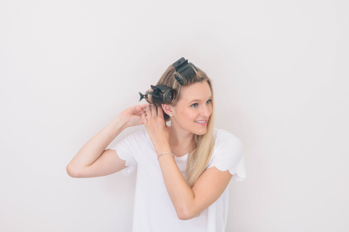 Style and beauty blogger, Leigha Gardner, of The Lilac Press using hot rollers for added hair volume and bounce. 