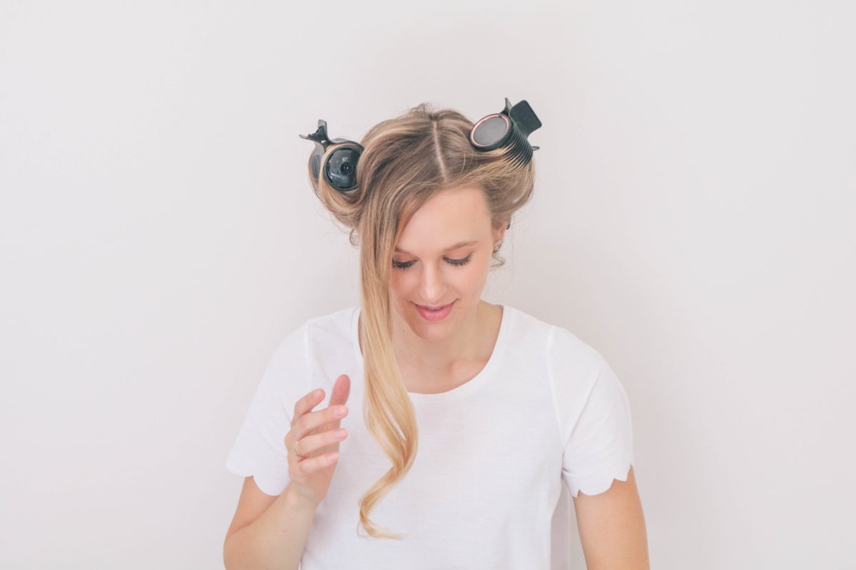 Style and beauty blogger, Leigha Gardner, of The Lilac Press using hot rollers for added hair volume and bounce. 