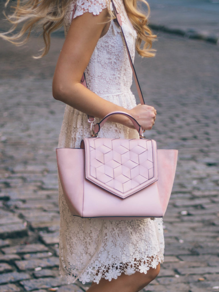 Style blogger, Leigha Gardner of The Lilac Press, wearing a little white lace dress, blush leather tote and statement shoes in NYC.