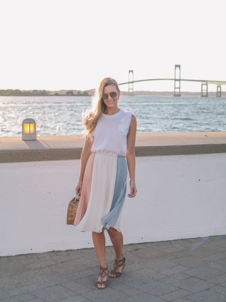 Style blogger, Leigha Gardner, of The Lilac Press wearing a cream, rose and gray-blue colorblocked skirt for dinner in Newport. 