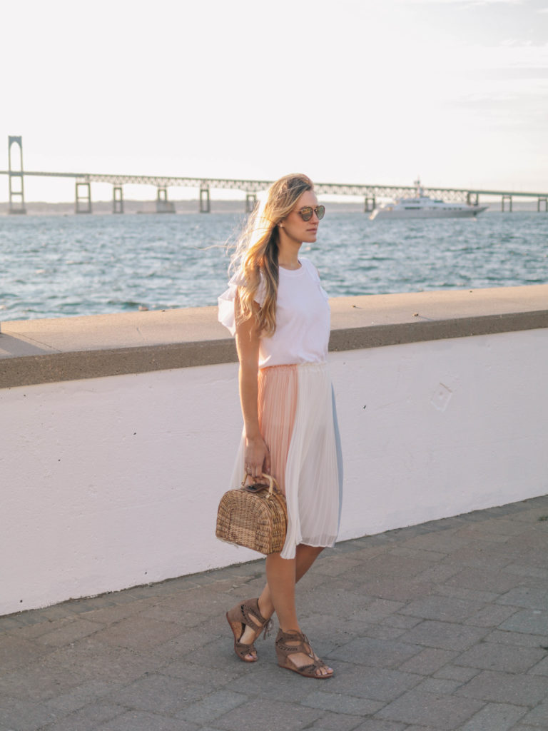 Style blogger, Leigha Gardner, of The Lilac Press wearing a cream, rose and gray-blue colorblocked skirt for dinner in Newport. 