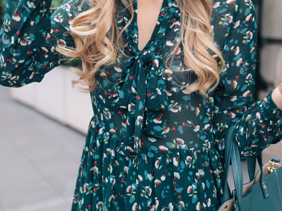 Fashion blogger, Leigha Gardner, of The Lilac Press wearing a transitional summer-to-fall outfit featuring of a teal floral Suncoo dress in New York City