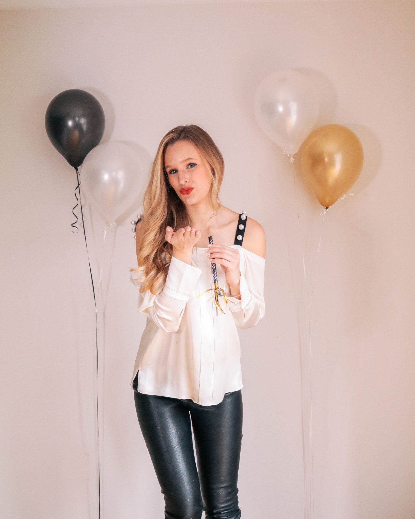 Fashion blogger, Leigha Gardner, of The Lilac Press sharing some designer looks for NYE including this embellished 3.1 Phillip Lim top and Stella McCartney faux leather leggings.