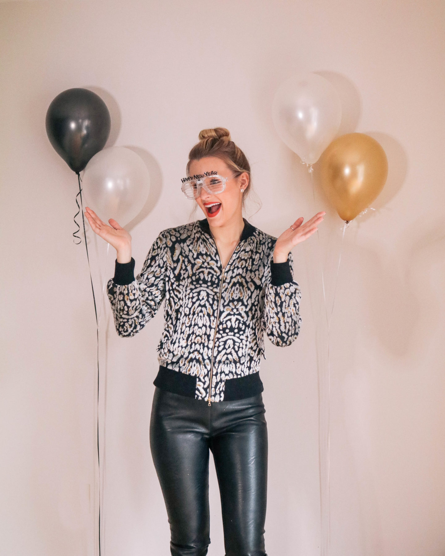 Fashion blogger, Leigha Gardner, of The Lilac Press sharing some designer looks for NYE including this velvet Adam Lippes bomber jacket and Stella McCartney faux leather leggings.