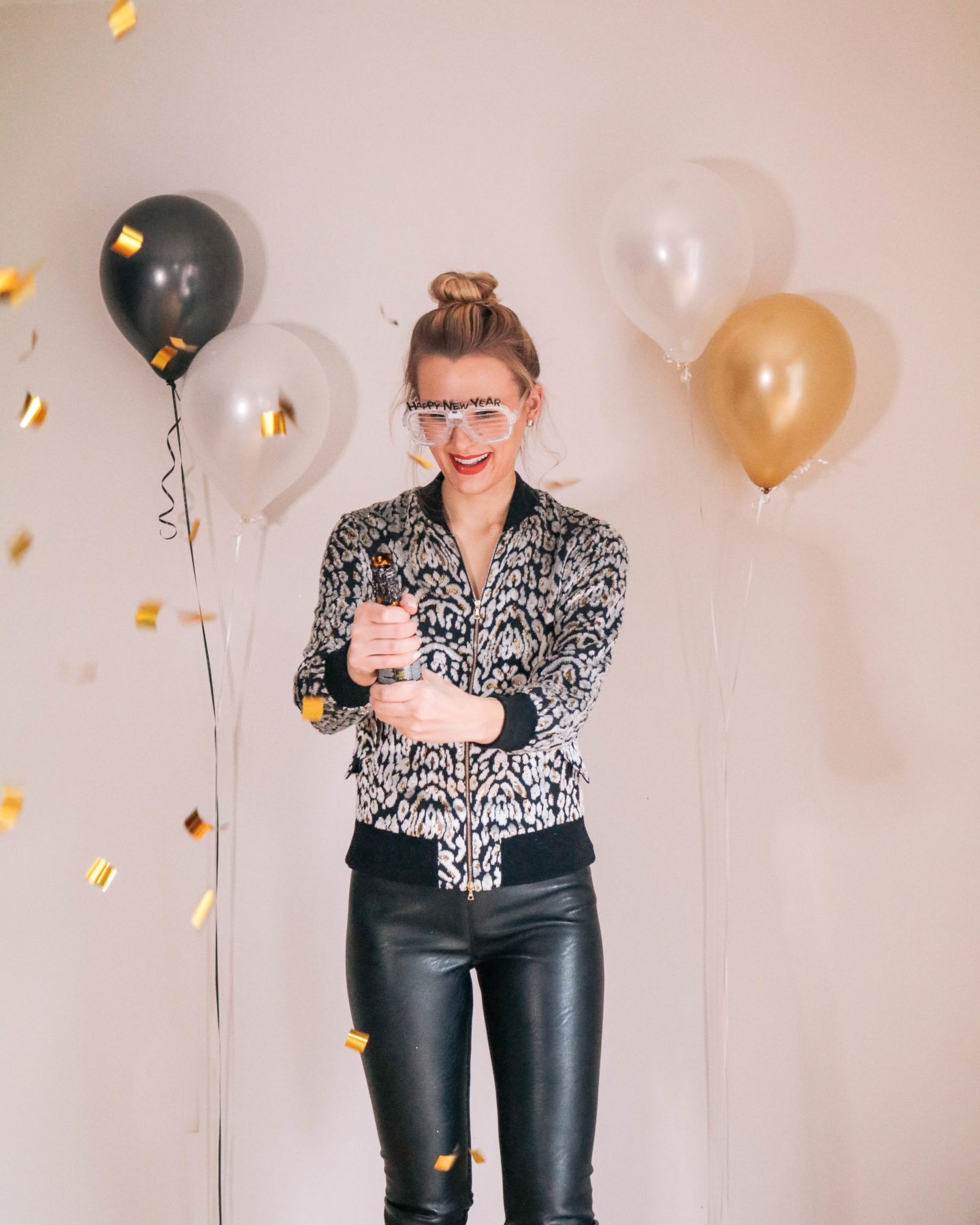Fashion blogger, Leigha Gardner, of The Lilac Press sharing some designer looks for NYE including this velvet Adam Lippes bomber jacket and Stella McCartney faux leather leggings.