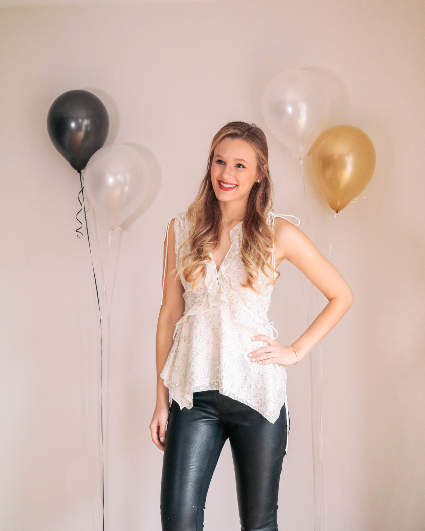 Fashion blogger, Leigha Gardner, of The Lilac Press sharing some designer looks for NYE including this silk Derek Lam top and Stella McCartney faux leather leggings.