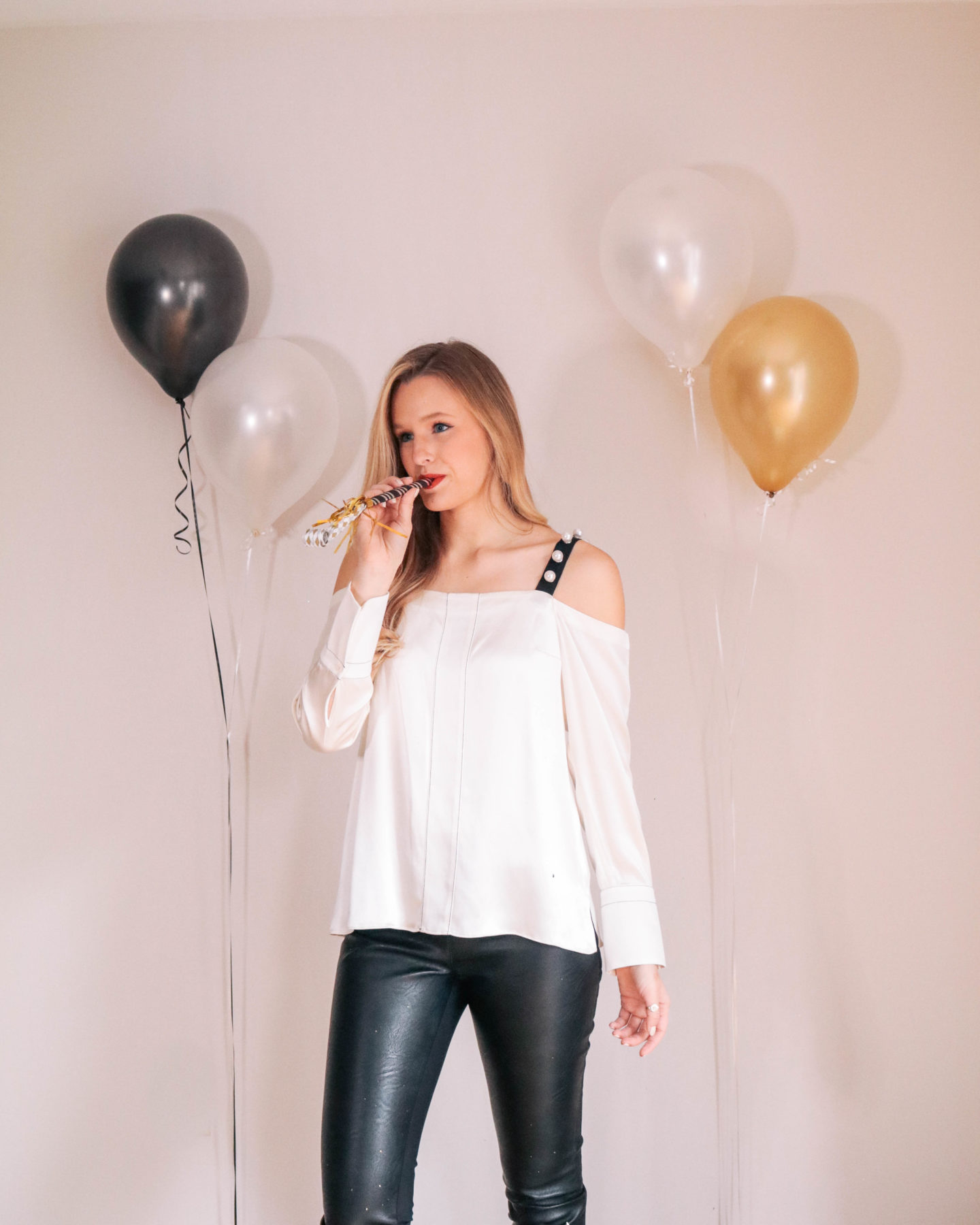 Fashion blogger, Leigha Gardner, of The Lilac Press sharing some designer looks for NYE including this embellished 3.1 Phillip Lim top and Stella McCartney faux leather leggings.
