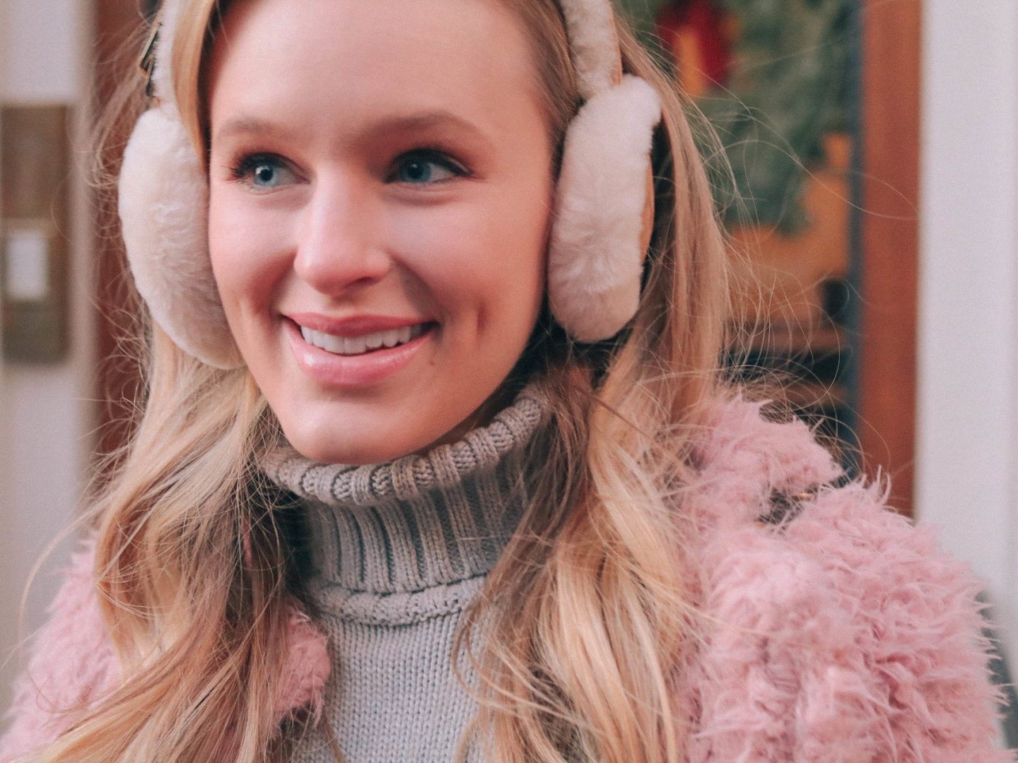 Leigha Gardner, of The Lilac Press, making the most of January in Boston with a pink faux fur coat, embroidered booties and sheepskin earmuffs. 