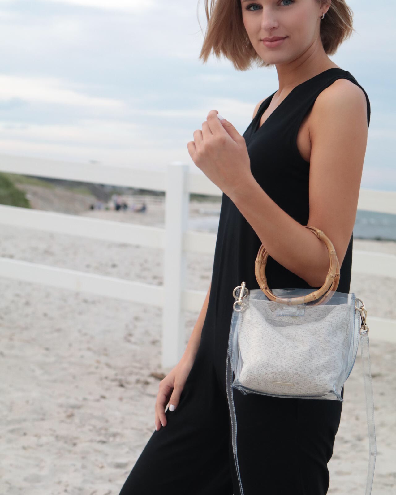 Leigha Gardner wearing PVC crossbody bag with bamboo handles at the beach