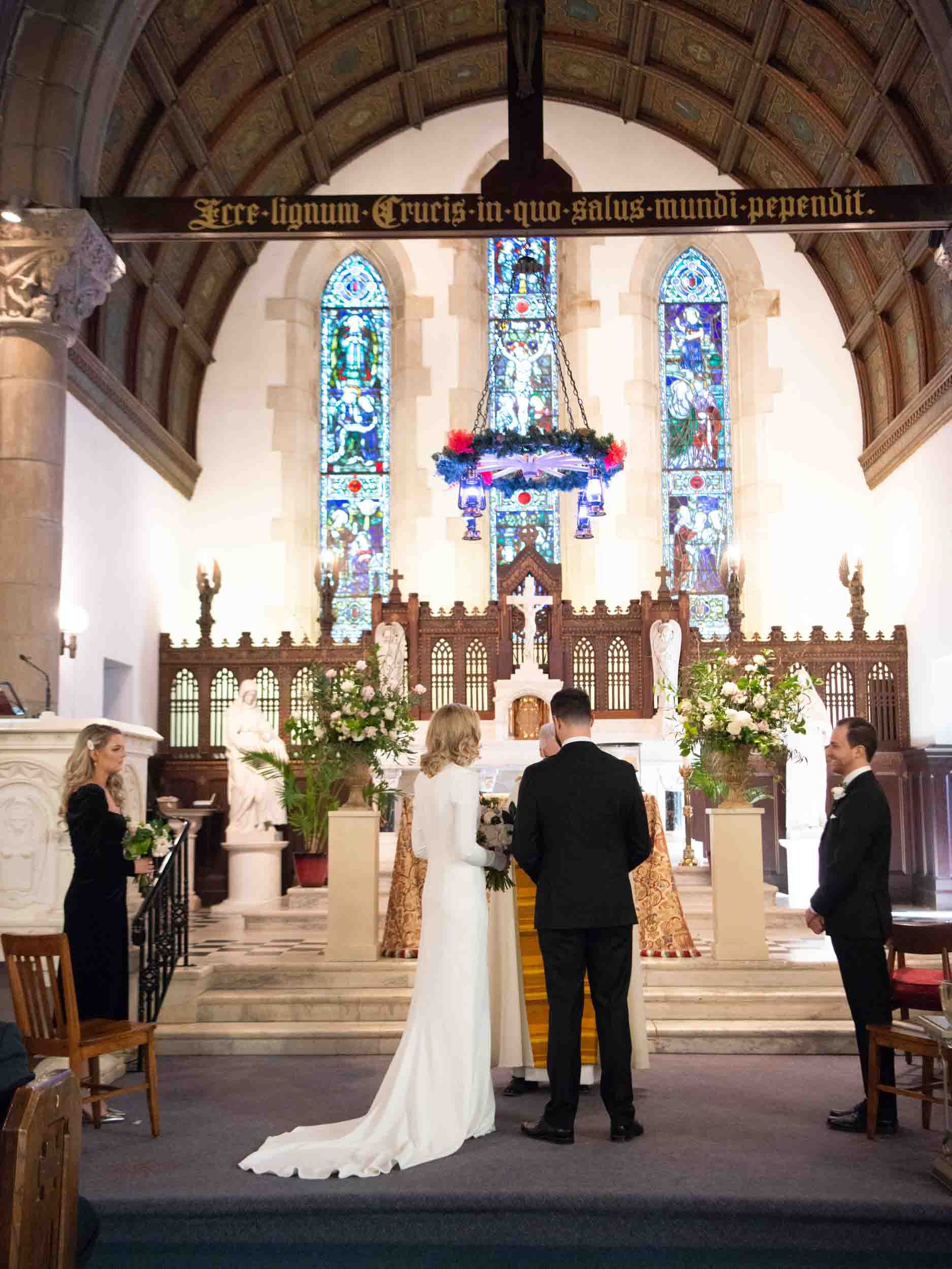 Bride and groom at the altar in a Catholic Church