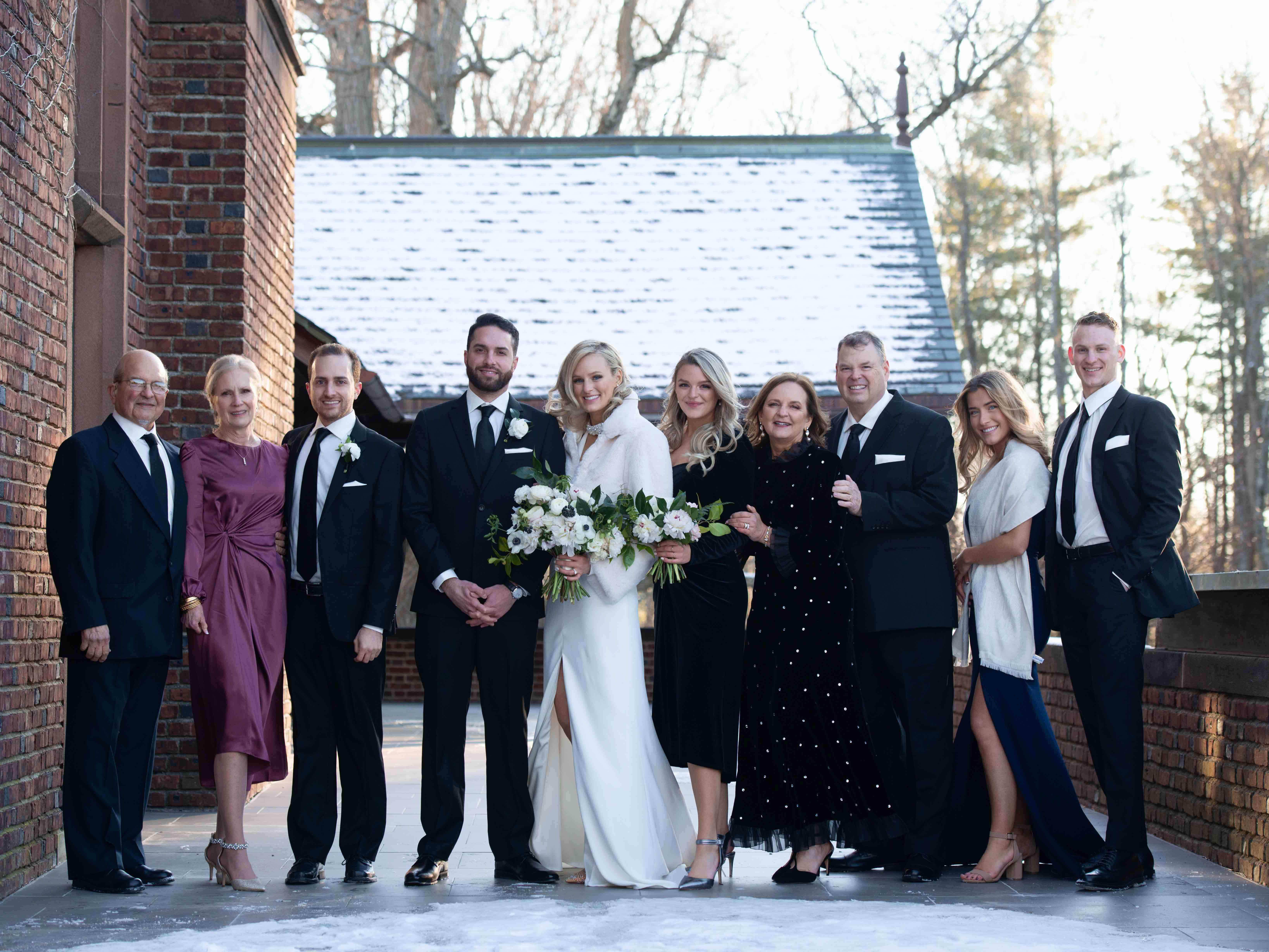 Bride and groom with family portrait, full guest list for lockdown micro-wedding