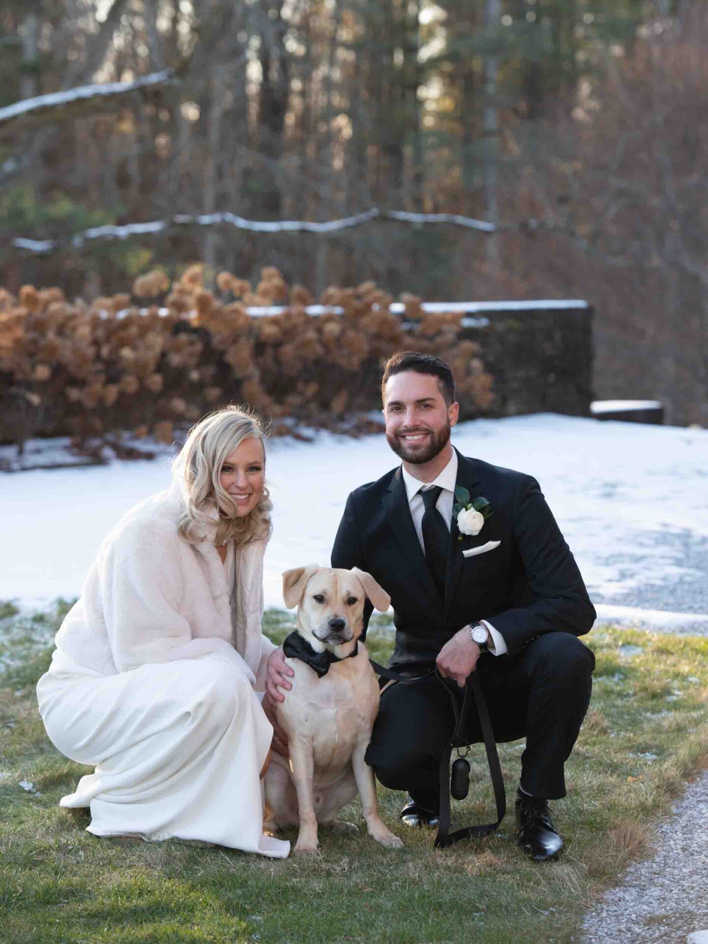 Bride and groom wedding portraits with puppy