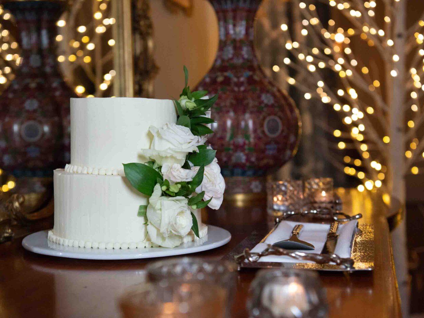 two-tier white wedding cake with flowers